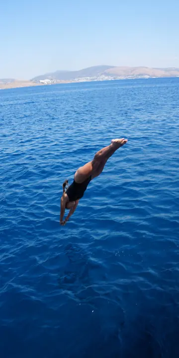 Diving off the boat into deep blue water on the SYB Turkey trip