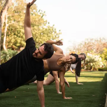 Side plank reach during a lawn workout on the SYB Nicaragua trip