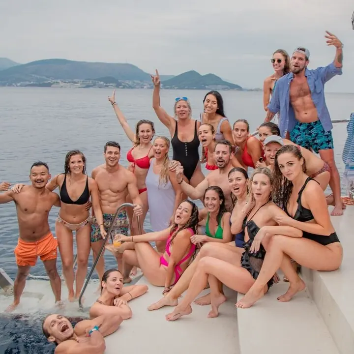The crew in swimwear on the back of the boat on the SYB Croatia trip