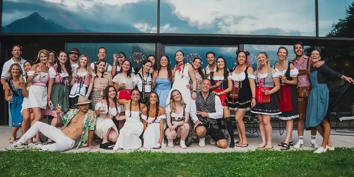 The whole crew in dirndls and lederhosen on dress up night on the SYB Dolomites trip