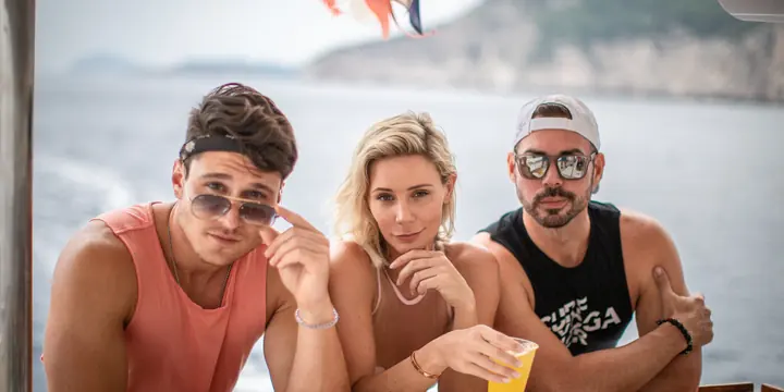 Three friends with a drink at the bar on the boat on the SYB Croatia trip