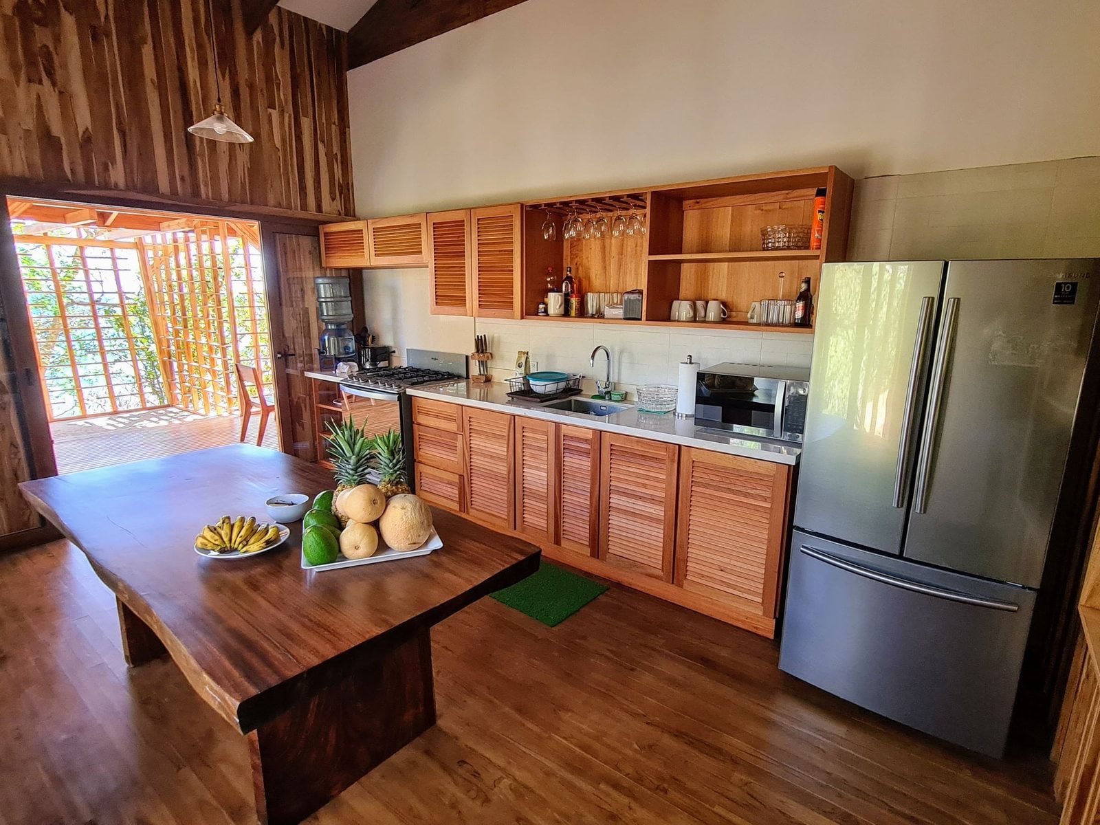 A villa kitchen with a big wooden table