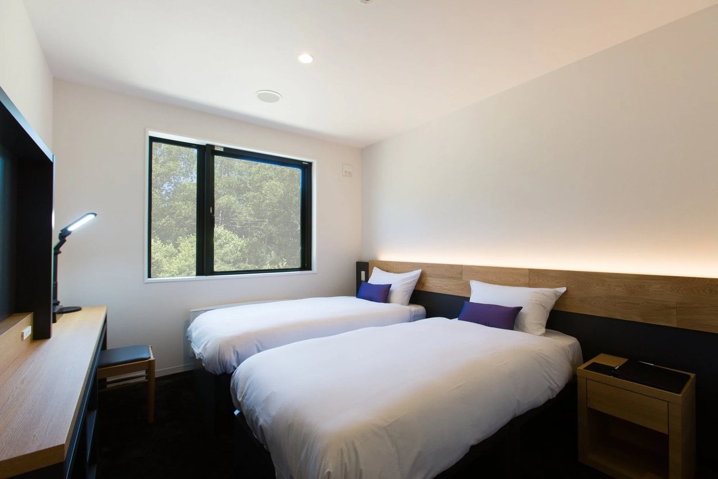 A twin room at Always Niseko, two separate beds