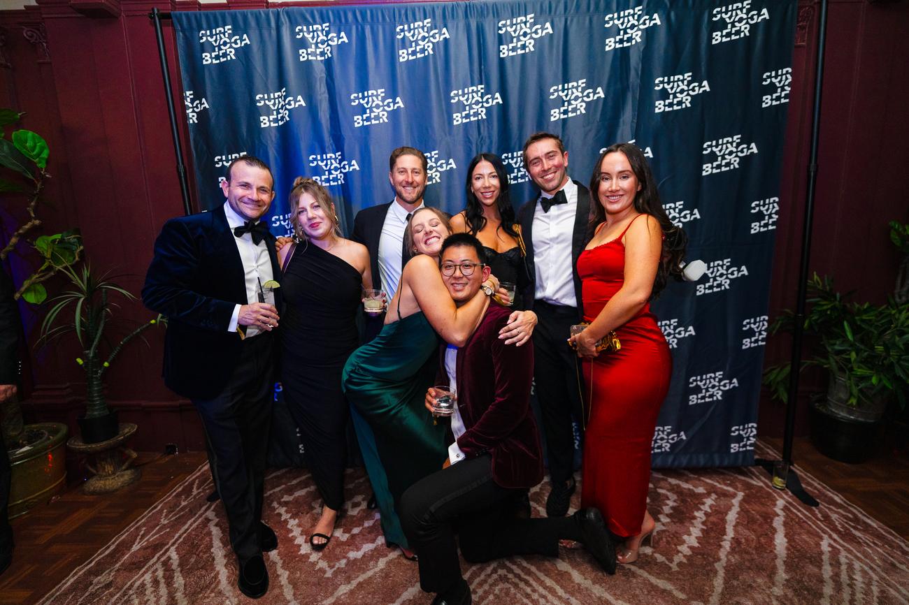 Black tie group at the SurfYogaBeer wall