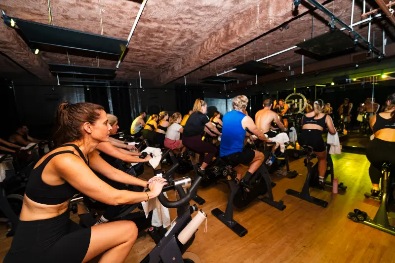 Rider pushing through the cycling class