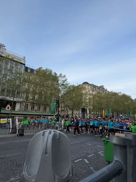 Huge crowd of runners packed at the start line of the Paris Marathon with Hardest Adventures.