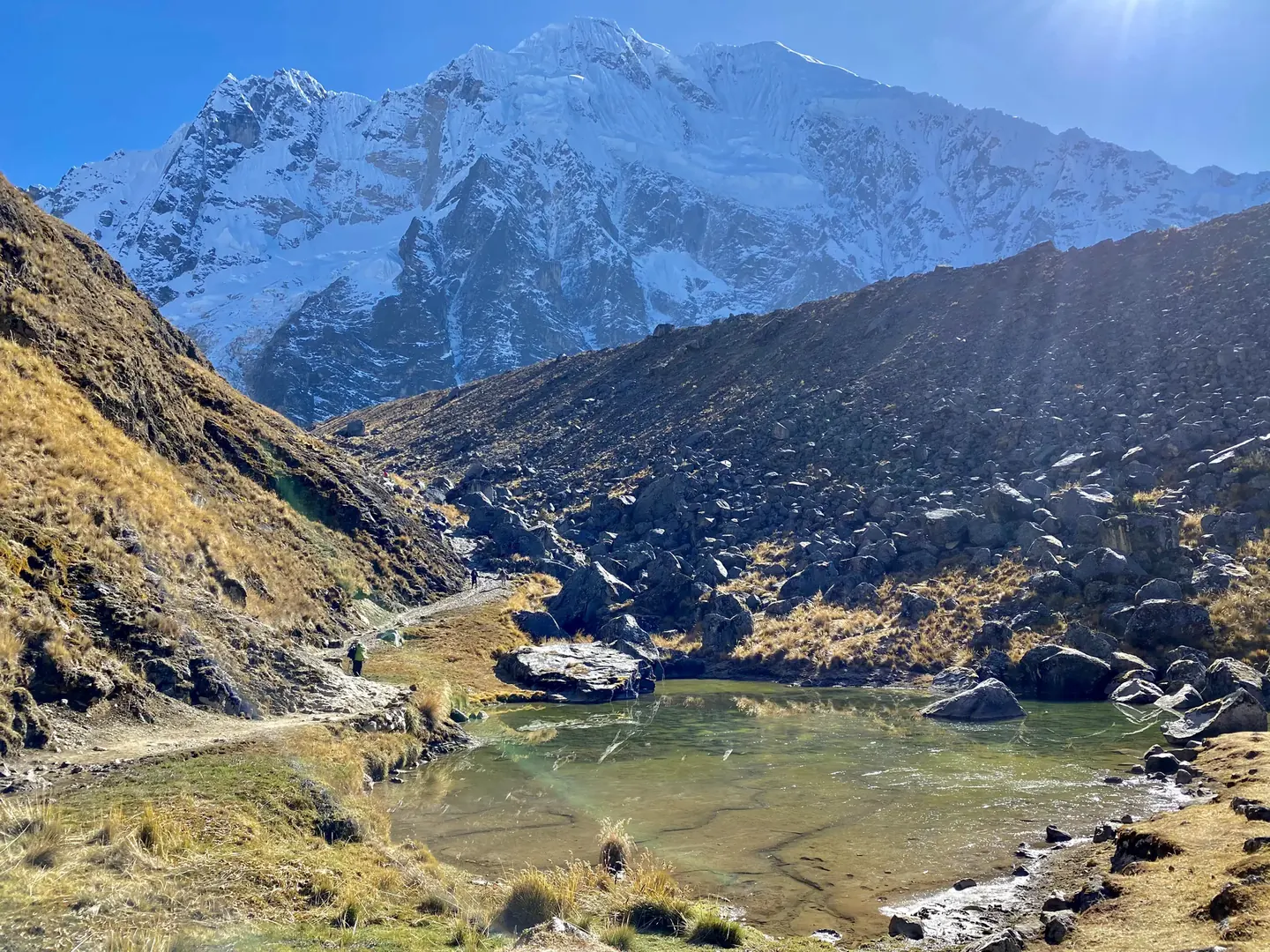 Trekkers at the Soraypampa camp beneath the Andes on the Salkantay route to Machu Picchu with Hardest Adventures.