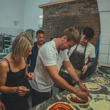Making pizzas by the brick oven on the SYB Amalfi Coast trip