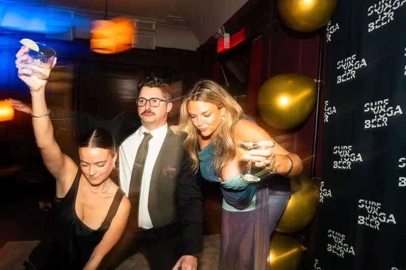 Three friends dancing in a blur of lights