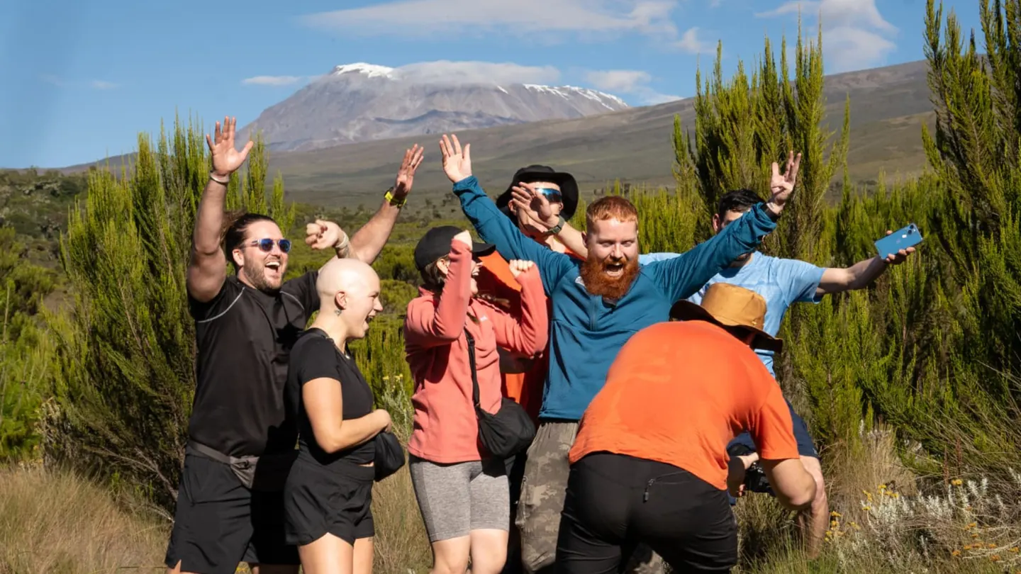 A student trek team cheering on the Kilimanjaro trail