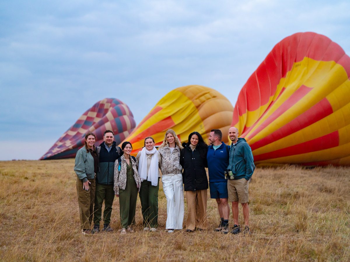 SurfYogaBeer crew with the hot air balloons at sunrise in the Masai Mara