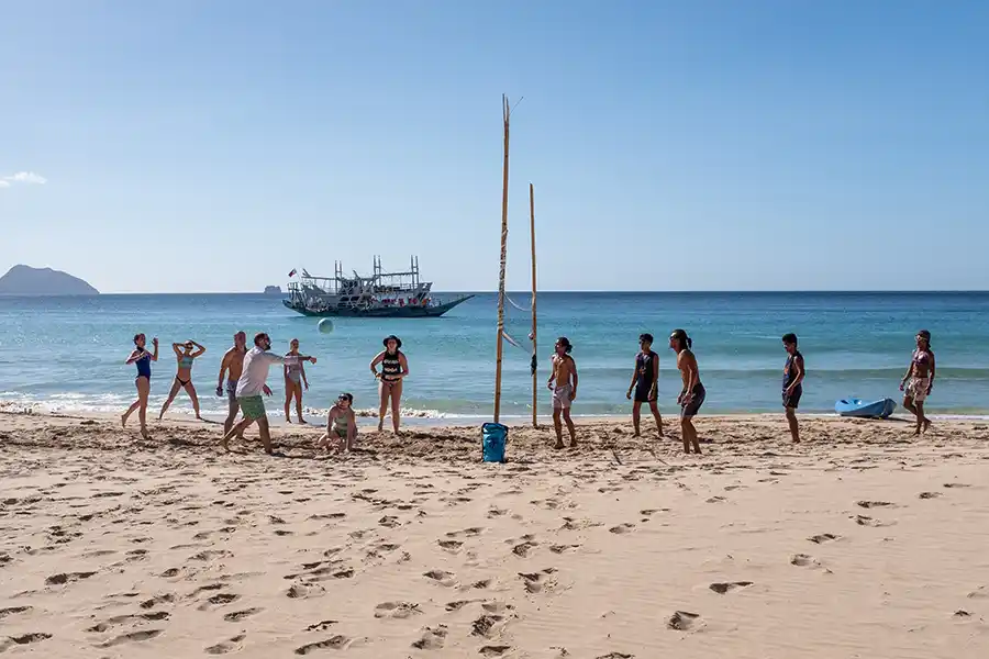 SurfYogaBeer beach volleyball game on a remote Palawan island