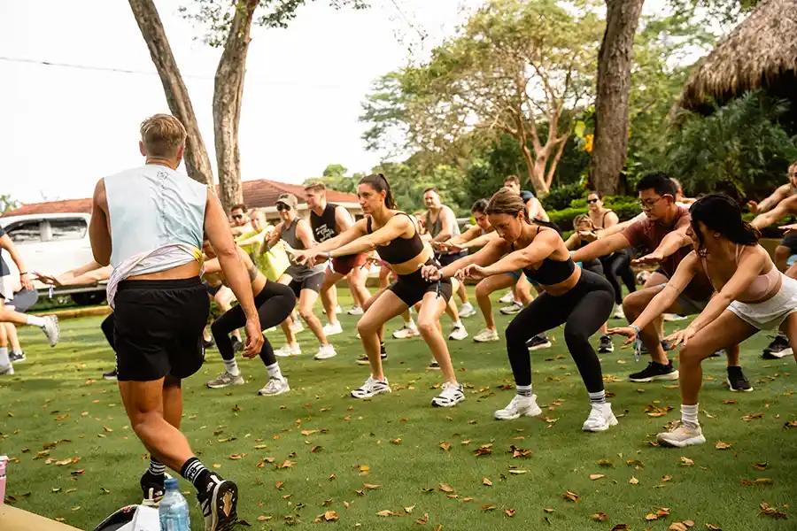 SurfYogaBeer group workout on the grass in Nicaragua