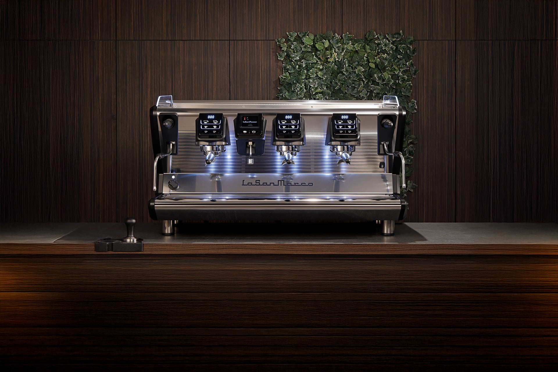 Barista pulling espresso on a La San Marco machine