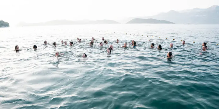 The group swimming together in the open sea on the SYB Croatia trip