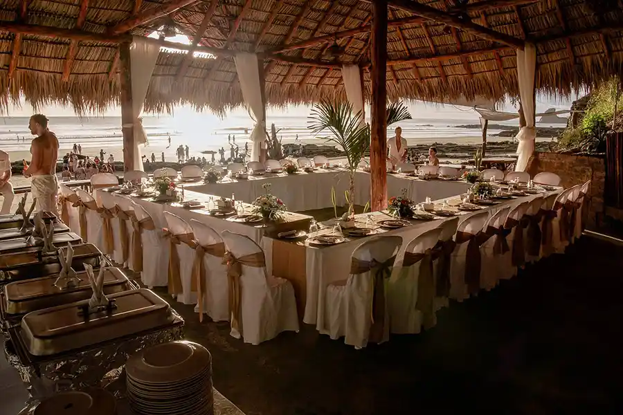 All white New Year dinner set up on the beach in Nicaragua