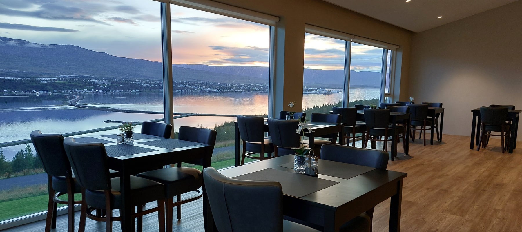 The breakfast room at Hafdals Hótel looking over the fjord to Akureyri