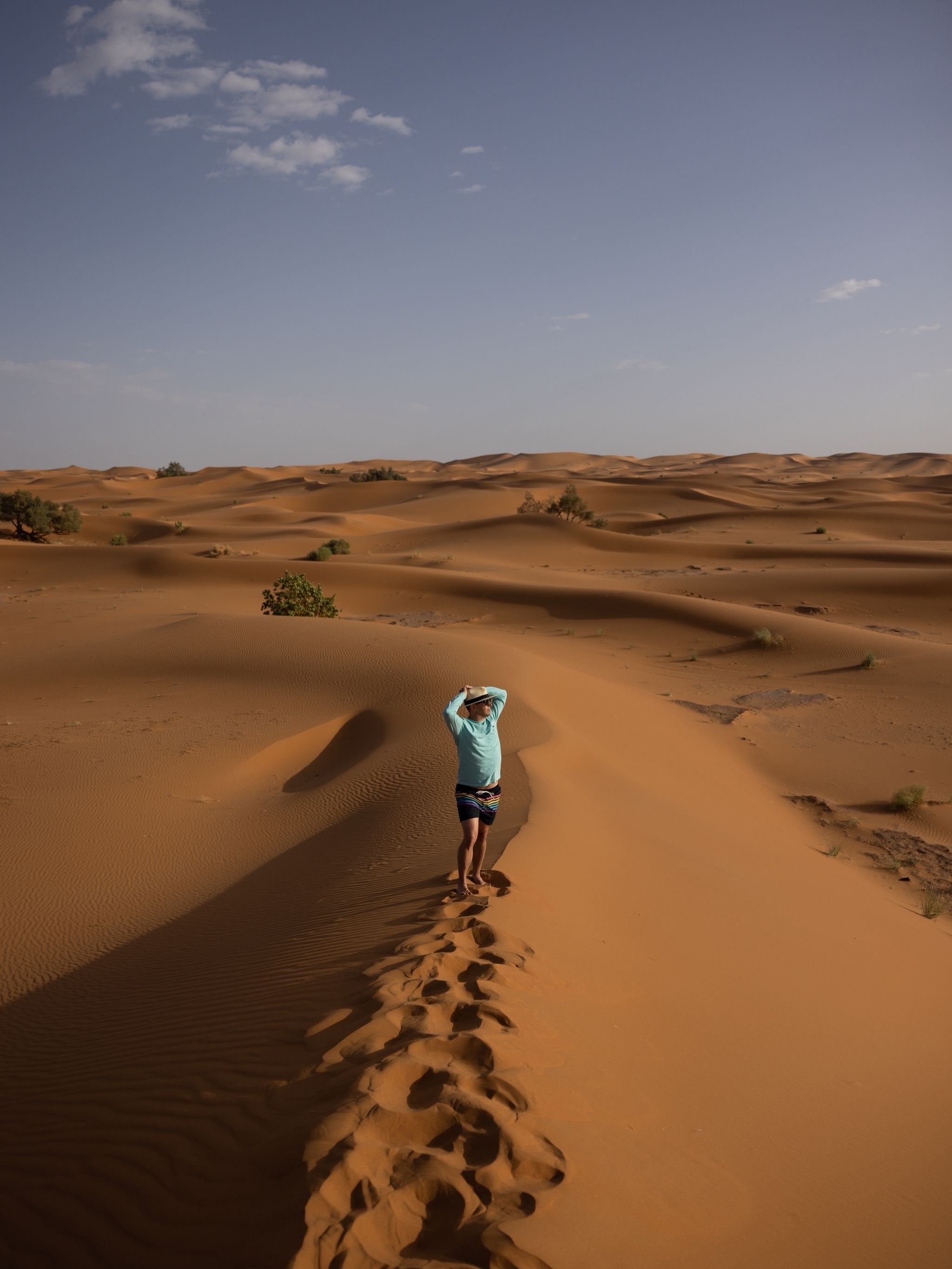 One of the crew on a dune ridge in Erg Chebbi, dunes all the way to the horizon
