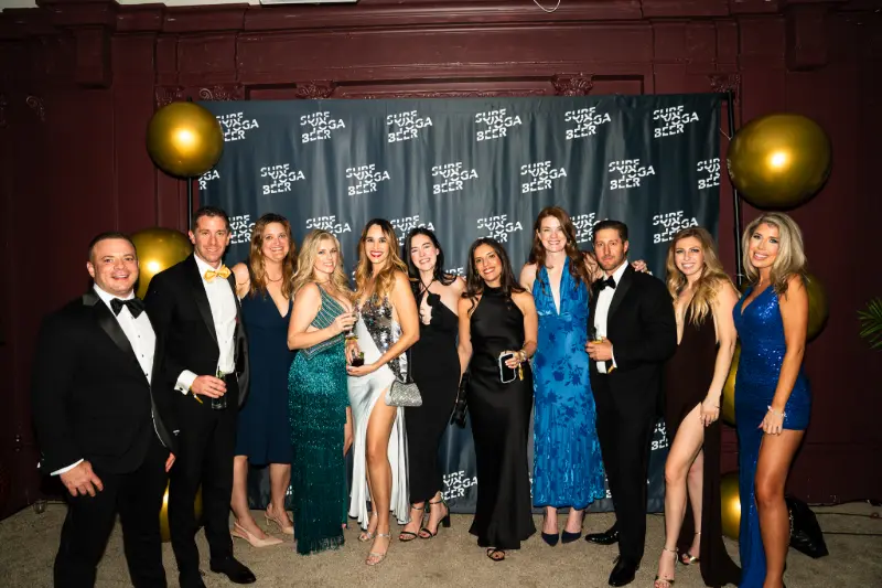 A big group posing at the photo wall