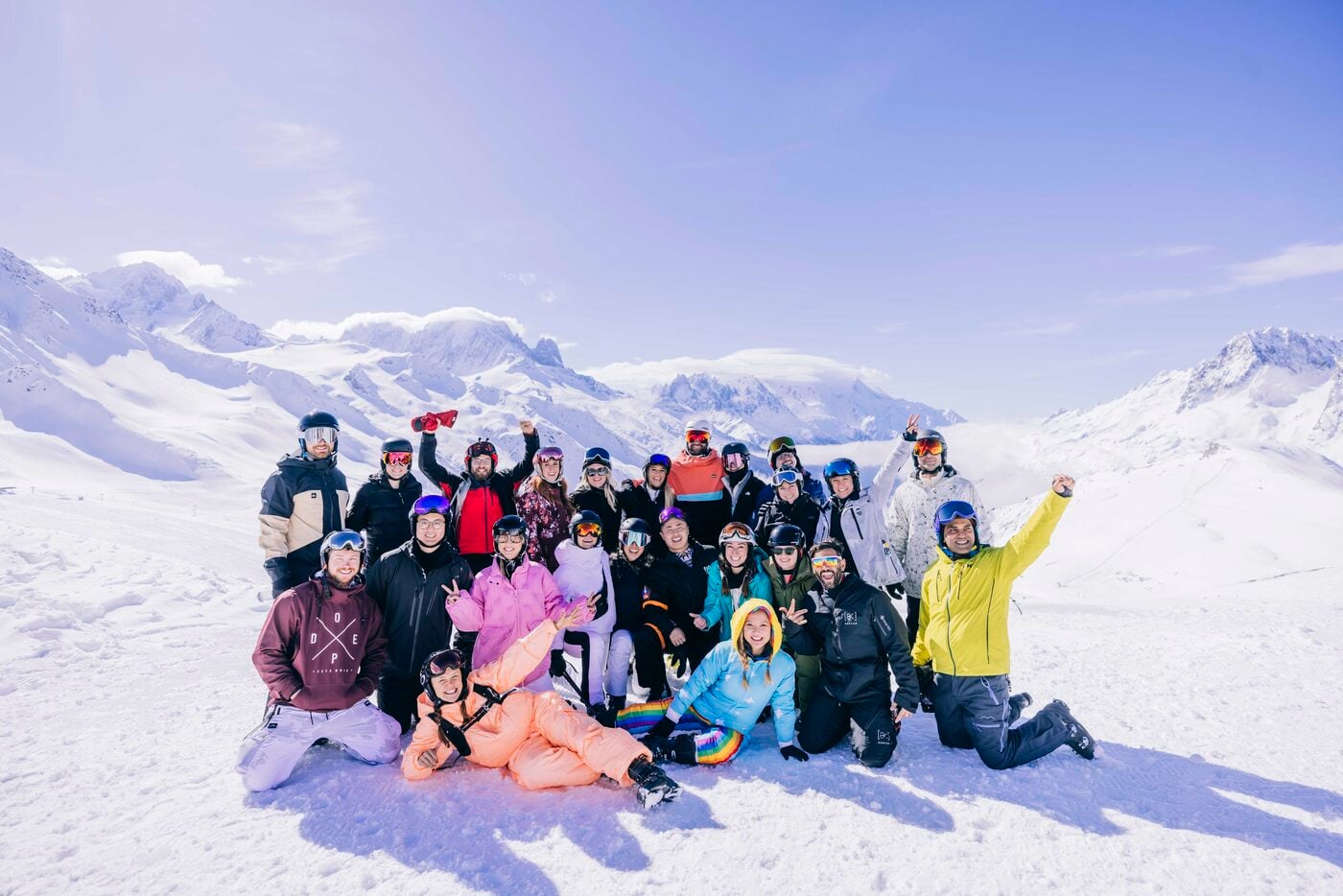 An SYB ski crew in costume posing together on the snow