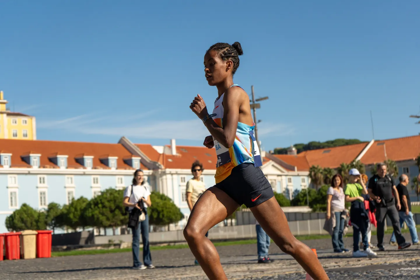 Elite runner surging clear at the front of the Lisbon Marathon.