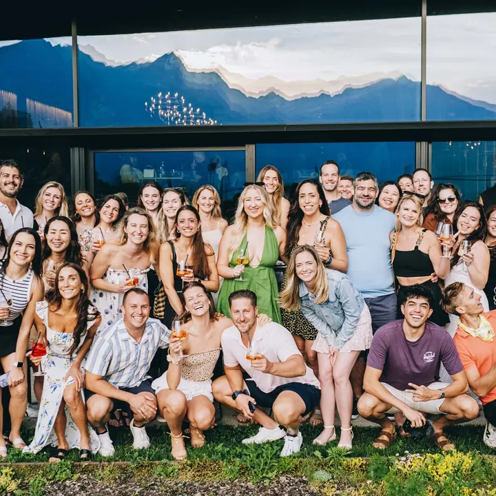 The whole crew with drinks in hand on the hotel lawn on the SYB Dolomites trip