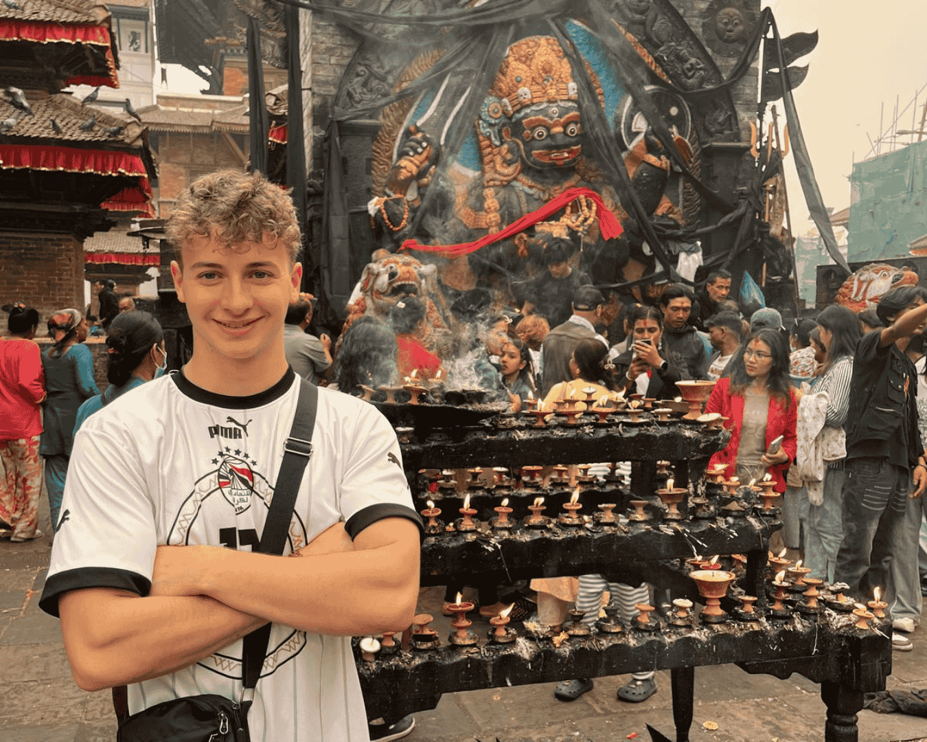 Hardest Adventures everest base camp trek participant posing in front of statue of Hindu god in Durbar square, Kathmandu, Nepal.