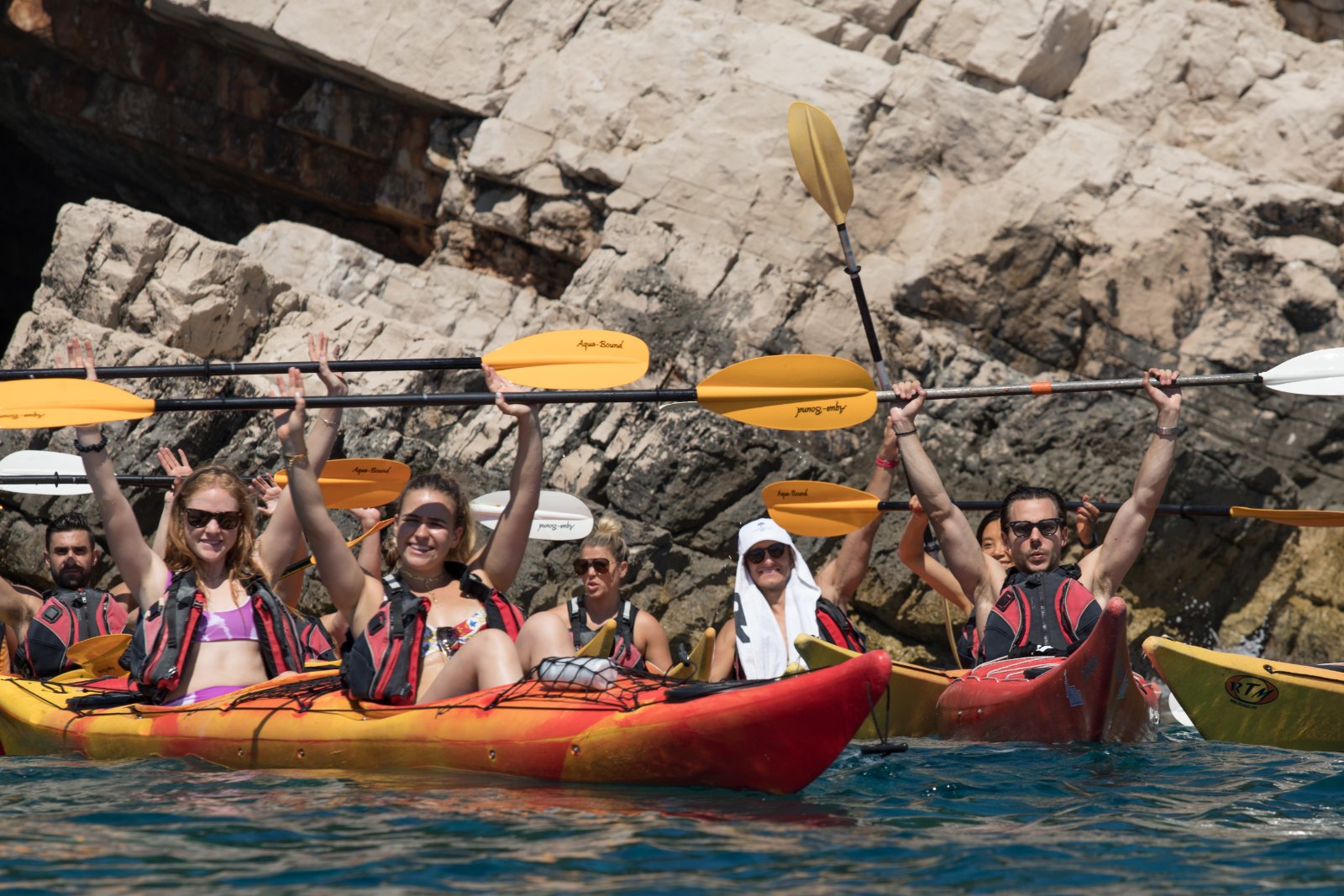 SurfYogaBeer guests kayaking into sea caves on the Adriatic in Croatia