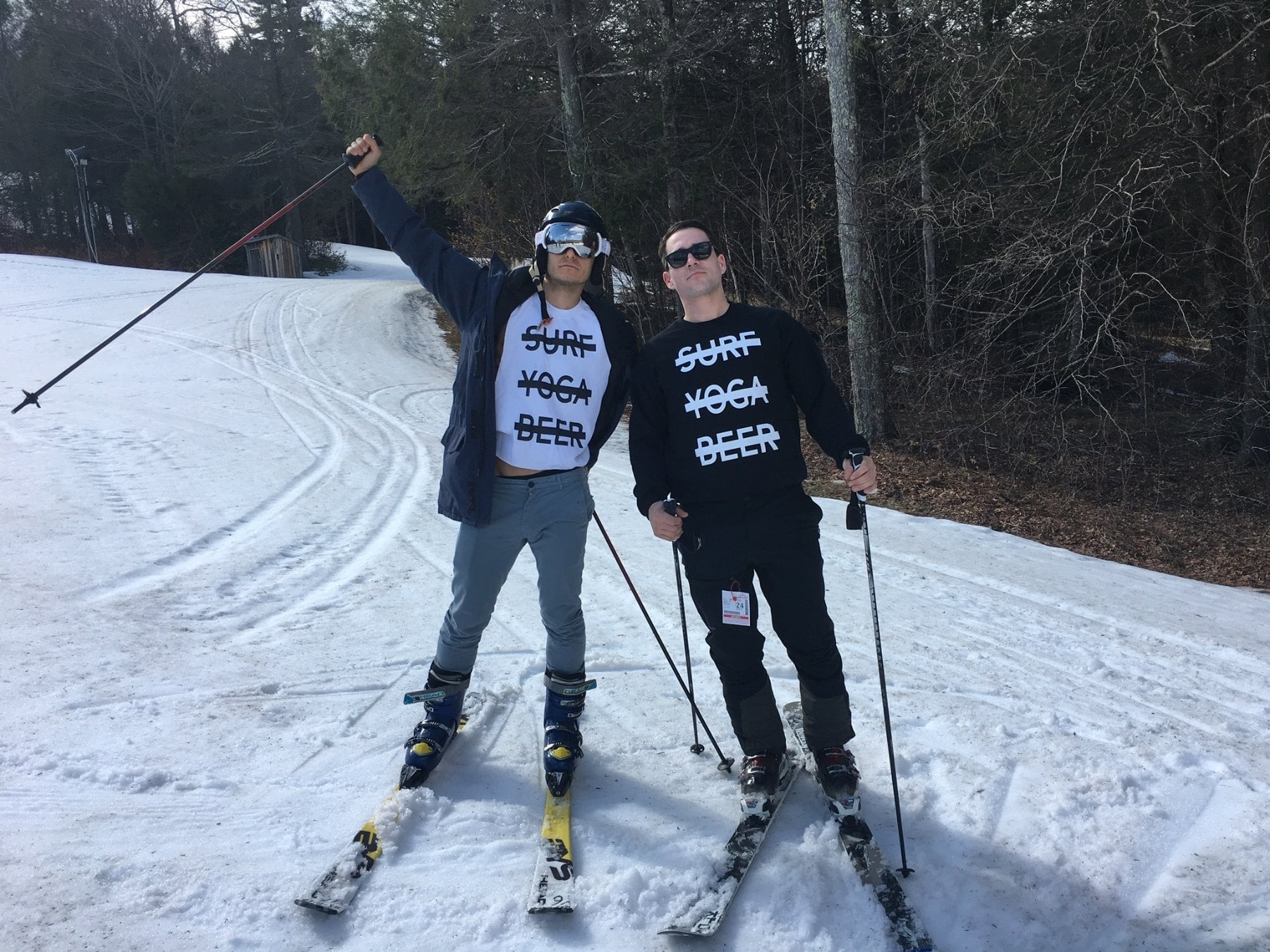 Two skiers on an SYB Vermont trip in black cross-out crewnecks