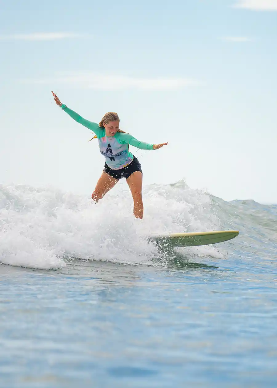 SurfYogaBeer guest riding a wave in Nicaragua