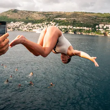 Backflip into the bay while a friend films it on the SYB Croatia trip