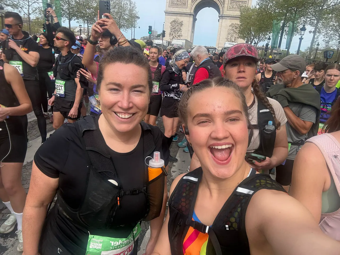 Hardest Adventures runners taking a selfie at the start line of the Paris Marathon.