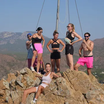 Group posing on a rocky summit after a coastal hike on the SYB Turkey trip