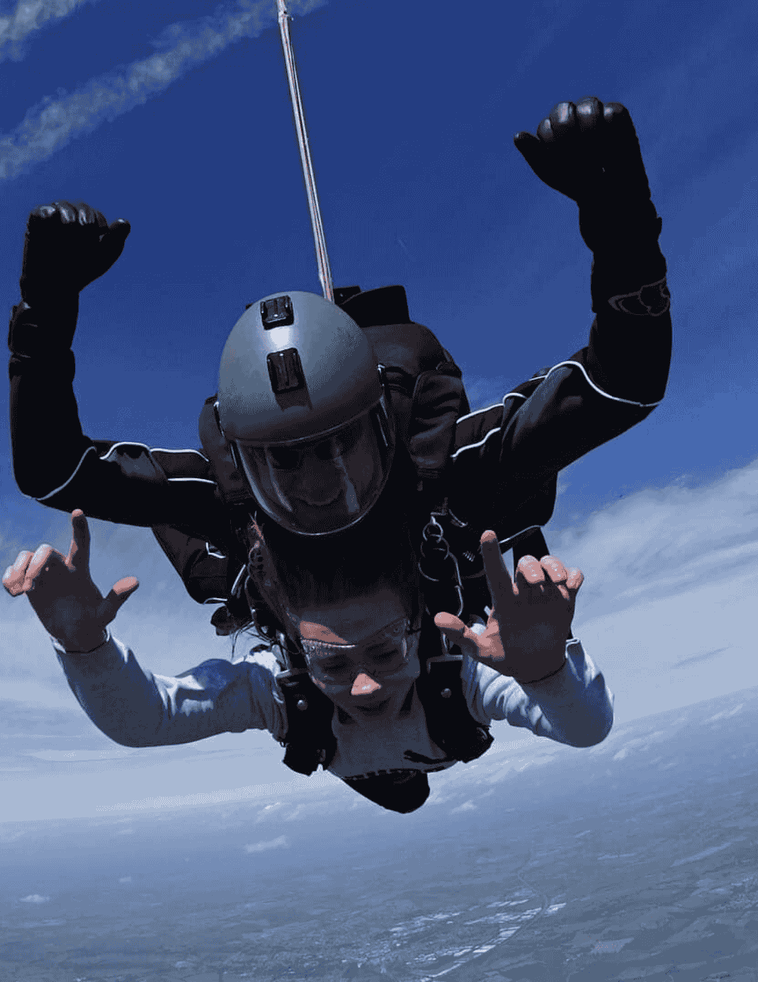Charity skydive participant flying through the air with farmland beneath them.