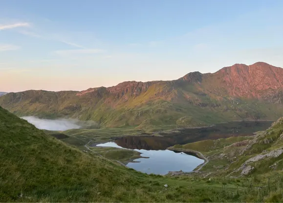 Beautiful drone shot of Mount Snowdon on a clear sunny day on the Hardest Adventures National Three Peaks corporate team building challenge.