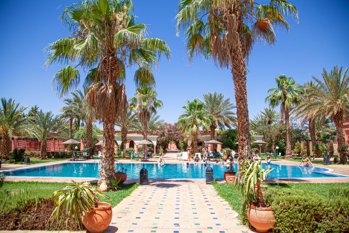 Riad pool and palm trees in Marrakech