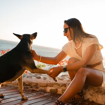 High five with a dog on the villa terrace above the ocean on the SYB Nicaragua trip