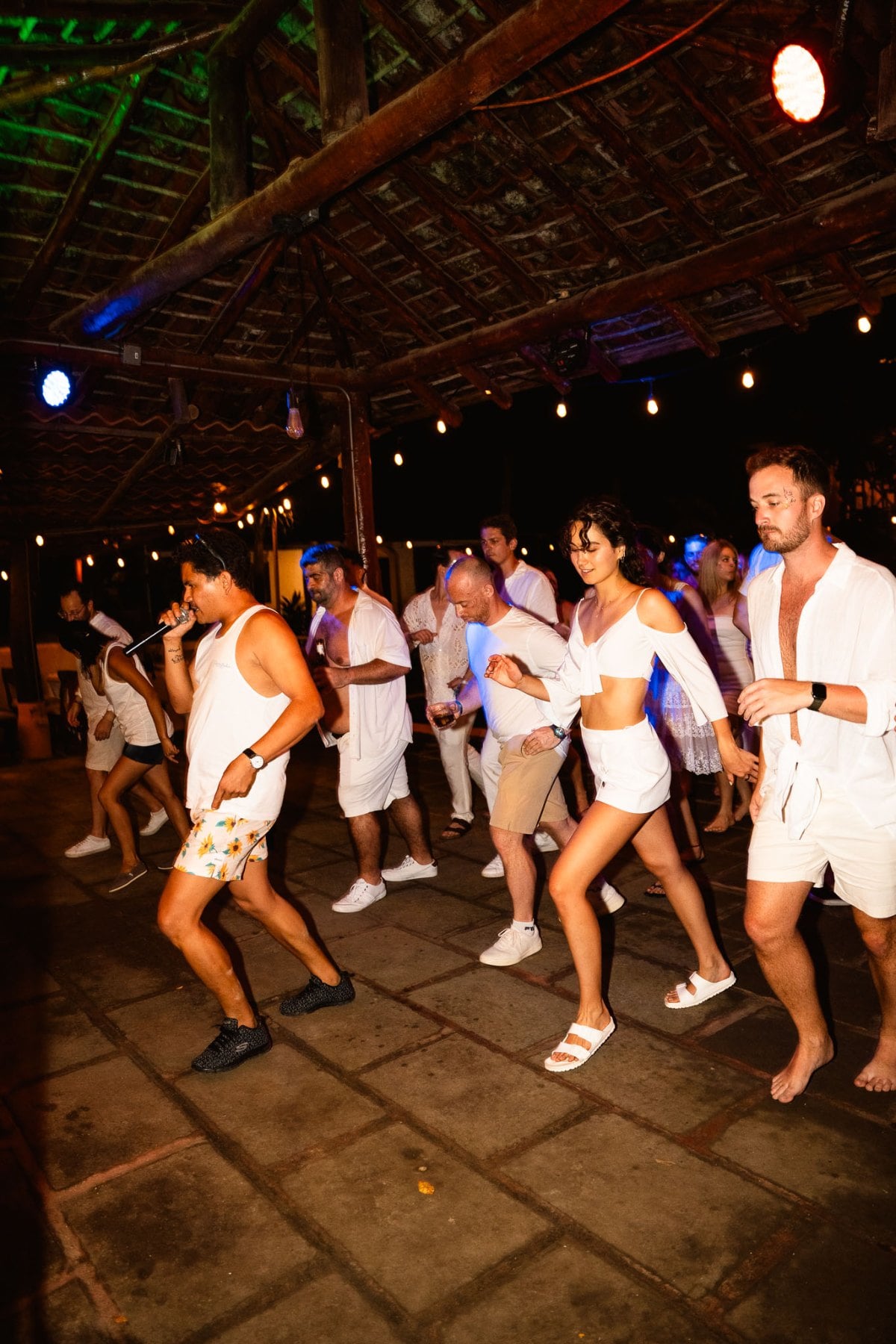 SurfYogaBeer crew in all white on the dance floor at the New Year party in Nicaragua