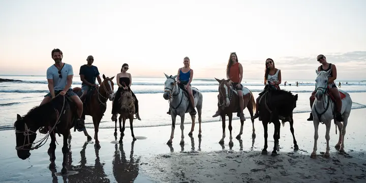 Group horseback ride along the shoreline in Nicaragua