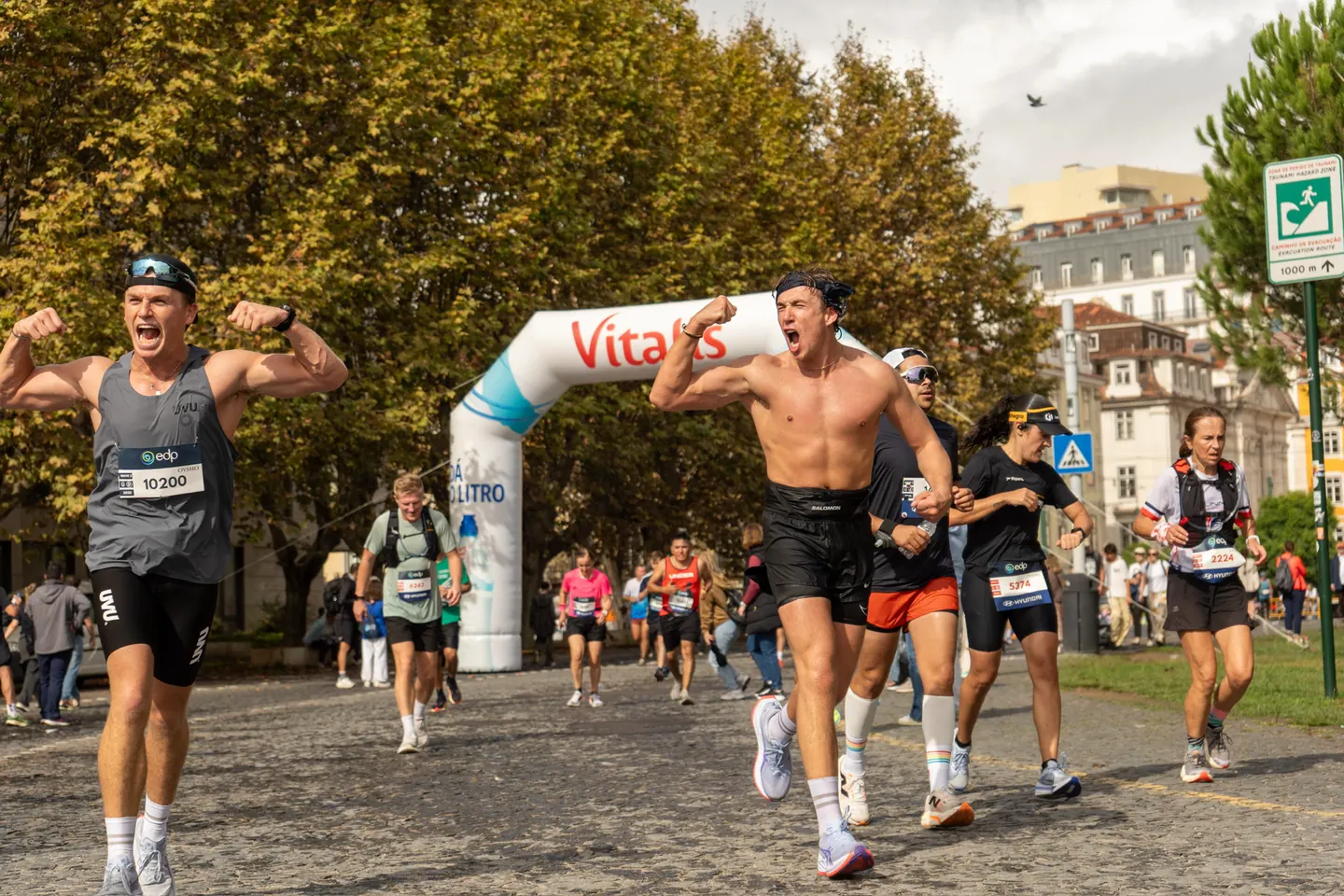 Hardest Adventures runner roaring with fists raised during the Lisbon Marathon.