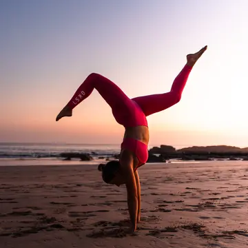 Handstand on the beach at sunset