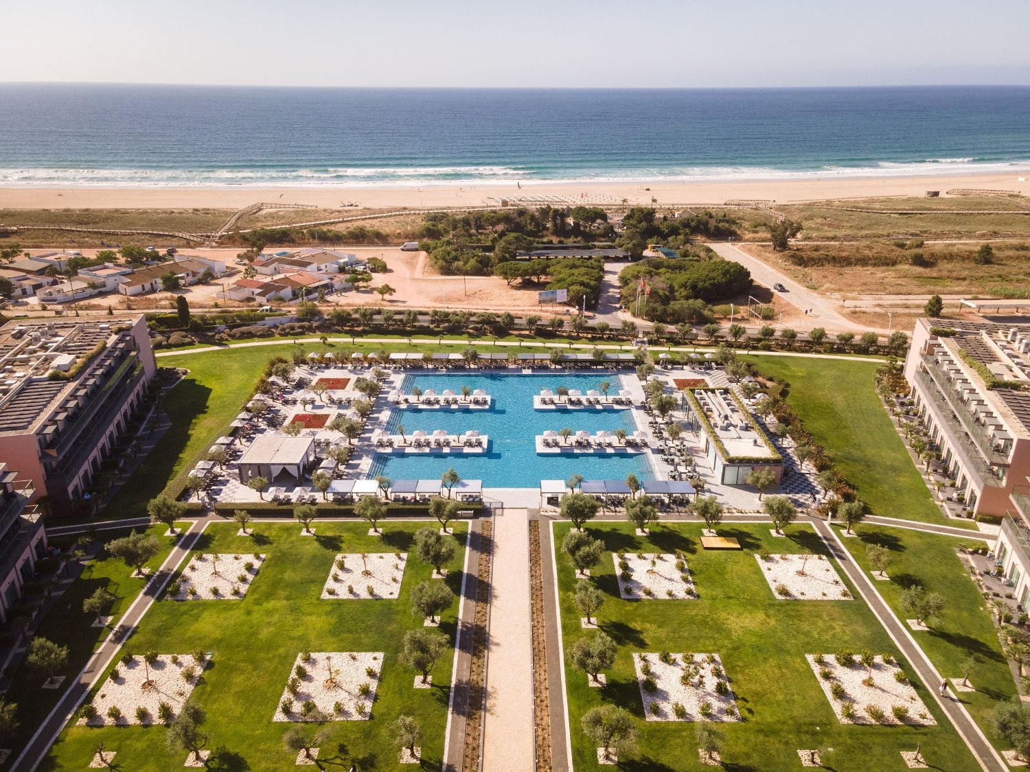Vila Gal&eacute; Lagos from above, with the pool and Meia Praia beach behind it