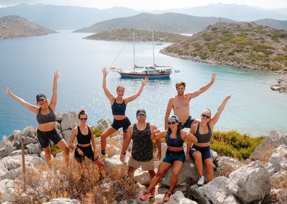 SurfYogaBeer crew hiking above a bay on the Turkish coast