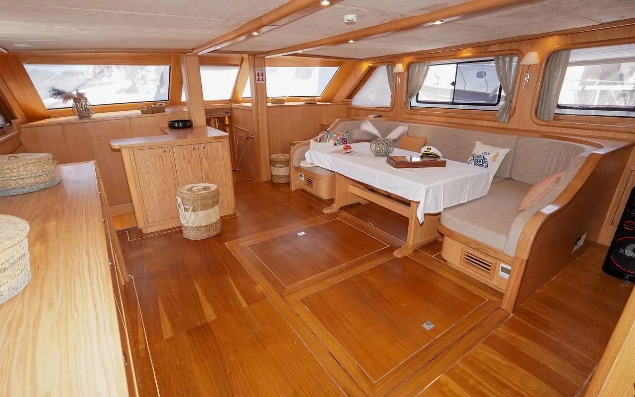 The wood-panelled saloon below deck