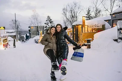 SurfYogaBeer crew walking through the snow in Niseko