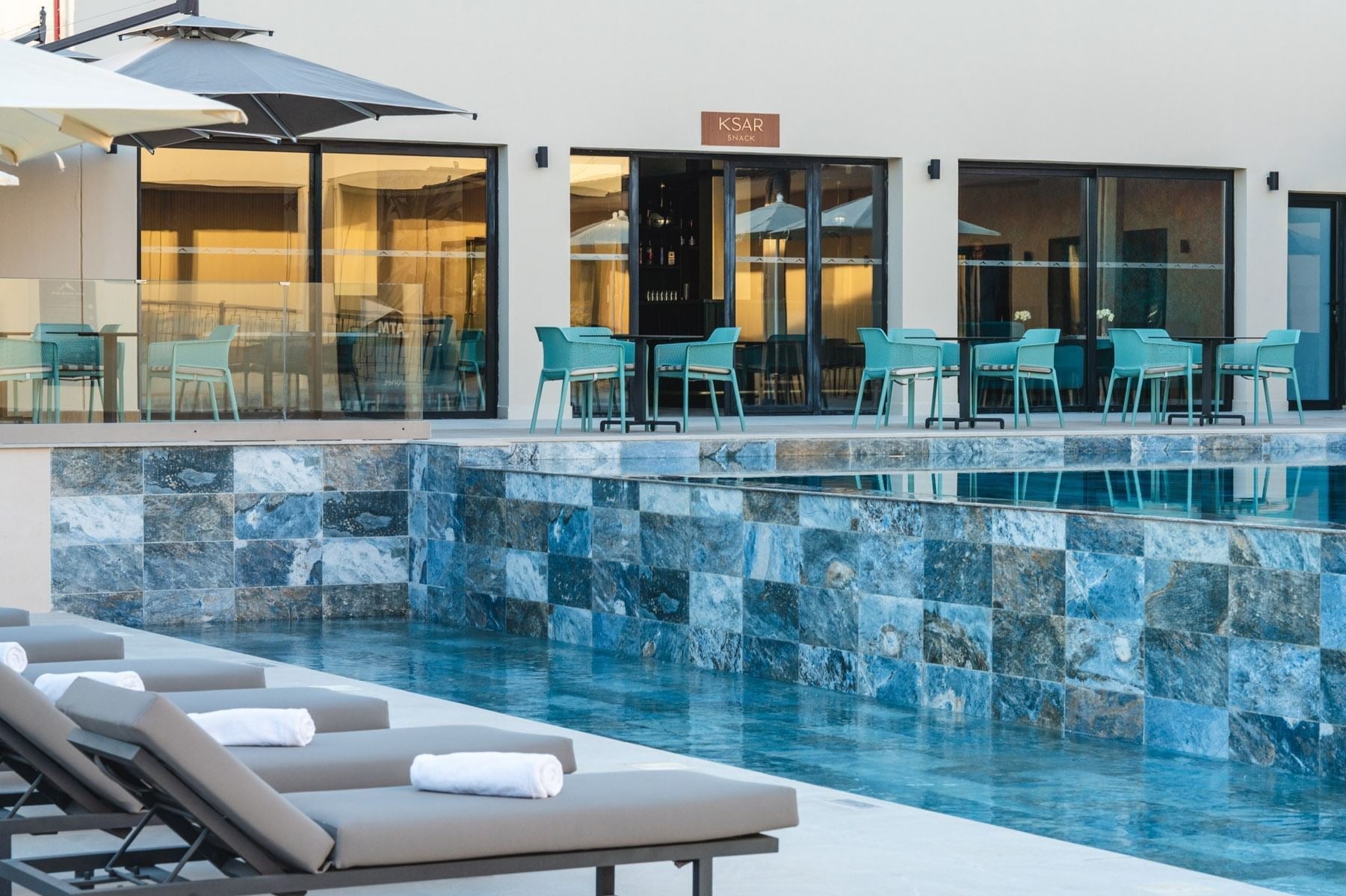 Loungers by the pool at Kenzi Rissani