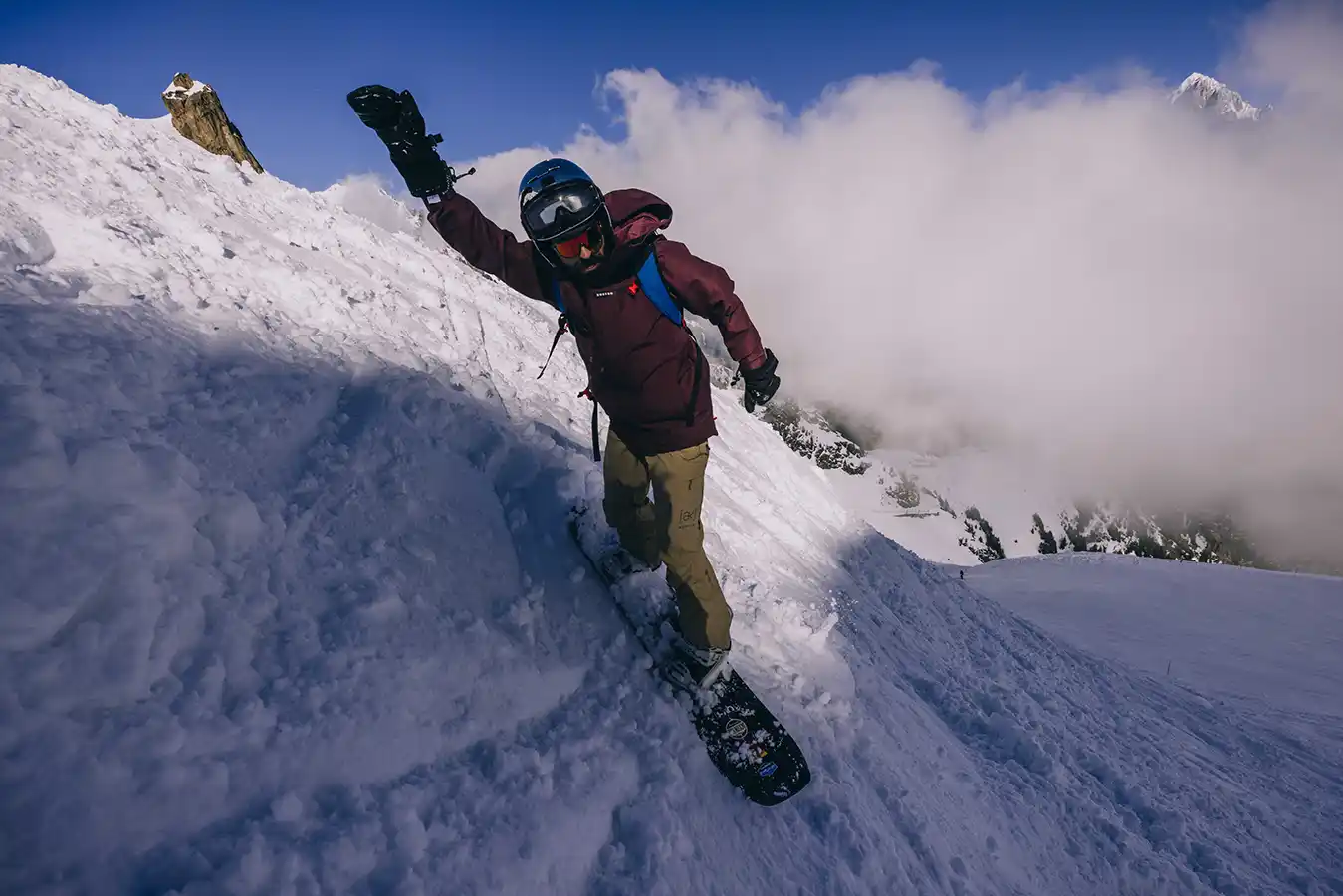 SurfYogaBeer crew doing a shot ski at a Chamonix bar