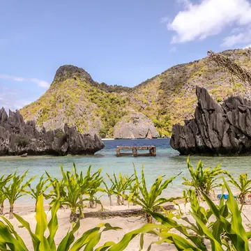 Limestone rocks around a turquoise lagoon on the SYB Philippines trip