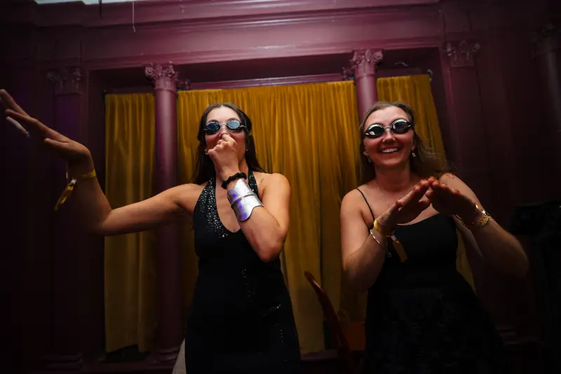 Dancing in front of the gold curtains