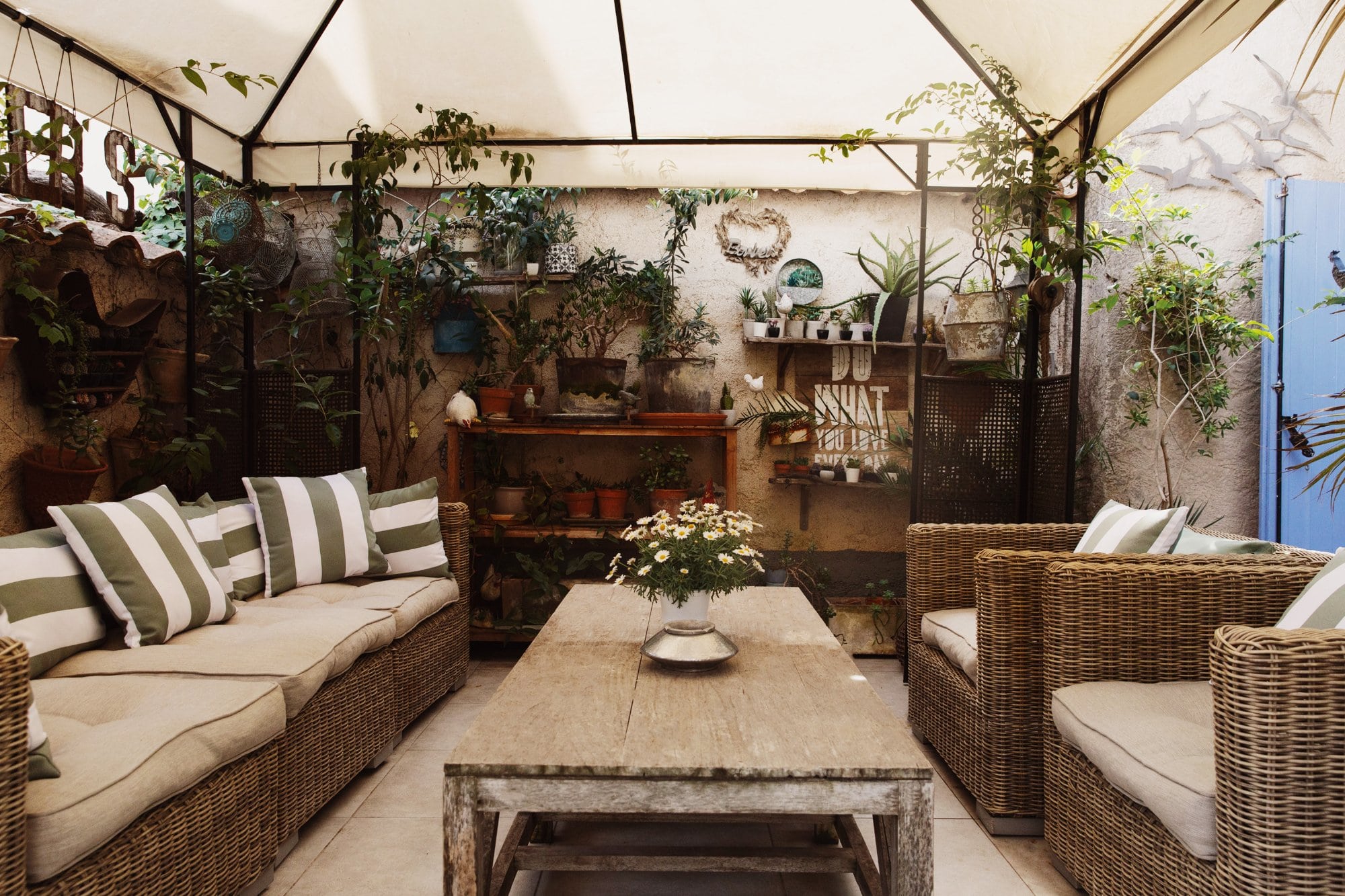 The shaded garden terrace at the Coq Hôtel